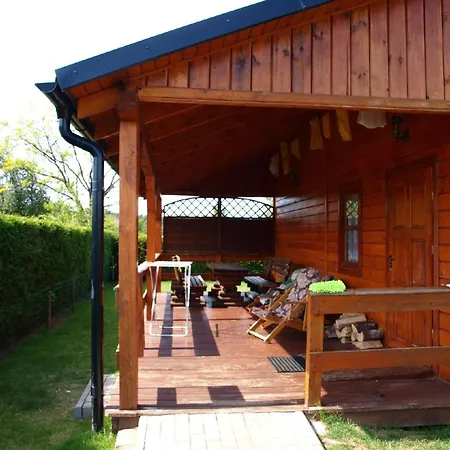 Holzhuette Mit Ueberdachter Terrasse Und Garten Kopalino